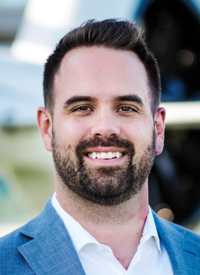 Aaron Kastner of the Dallas Cowboys in a blue suit