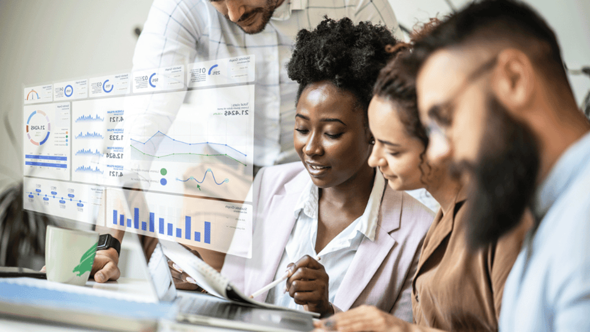 three people looking at a notebook and a data visualization popping up in 3D