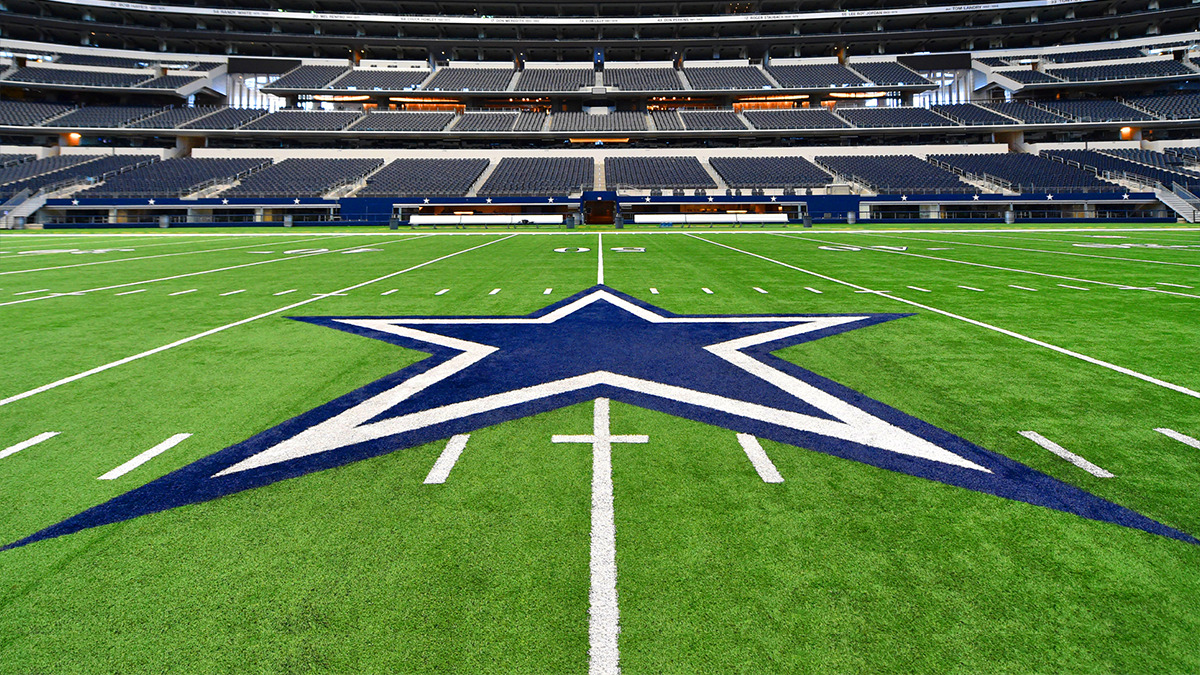 An aerial shot of the Cowboys logo painted on a football field