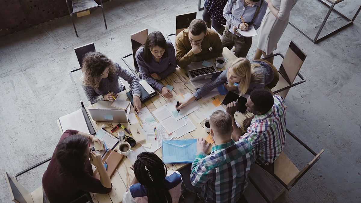 A group collaborating around a table brainstorming ideas