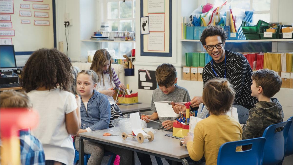 A teacher leading children in hands-on activities