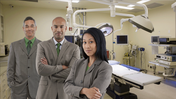 two males and one female dressed in business attire in a hospital surgical room