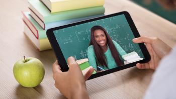 Video Conferencing With Female Teacher On Digital Tablet